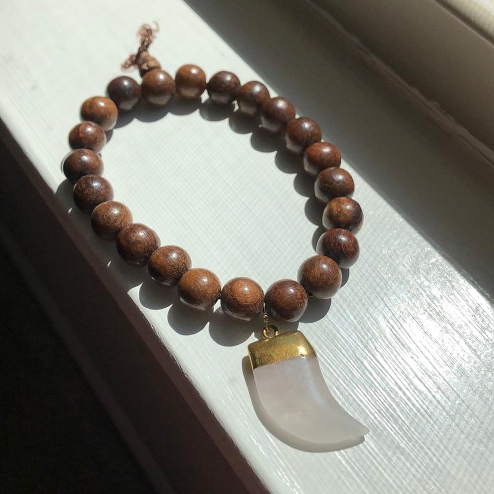 Wooden beaded bracelet with gemstone horn